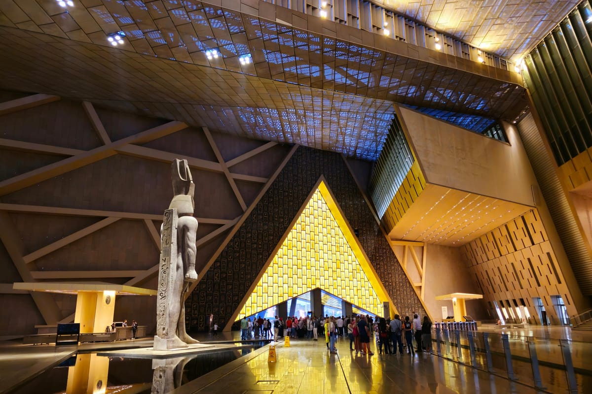 The Grand Hall of the Grand Egyptian Museum lit up at night