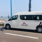 Deluxe Travel Egypt private minivan on the seafront for a Sharm El Sheikh airport transfer