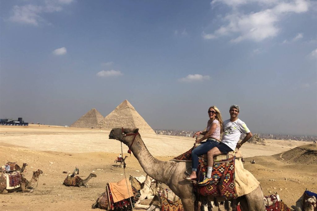 Guests on a camel ride at the Giza Pyramids
