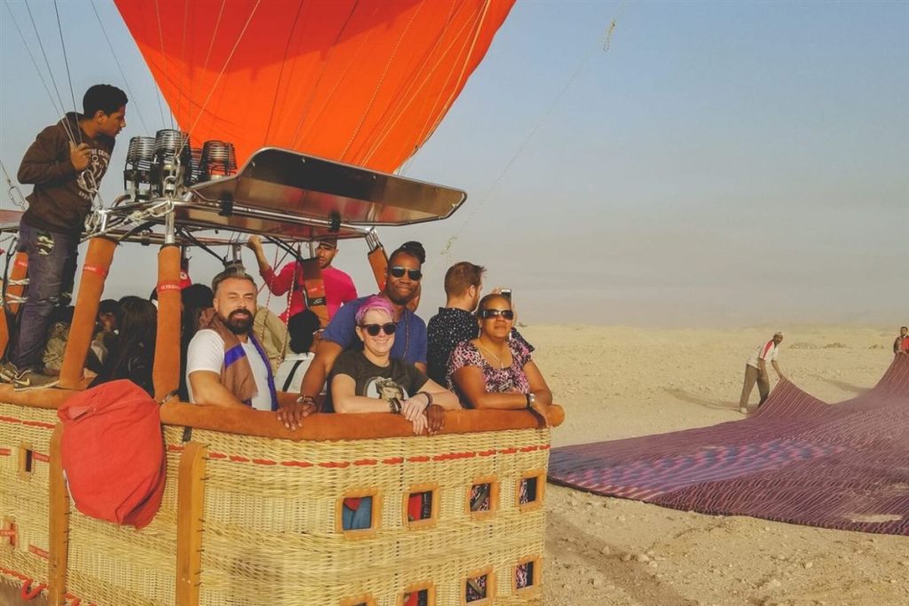 Guests in a hot air balloon over Luxor West Bank