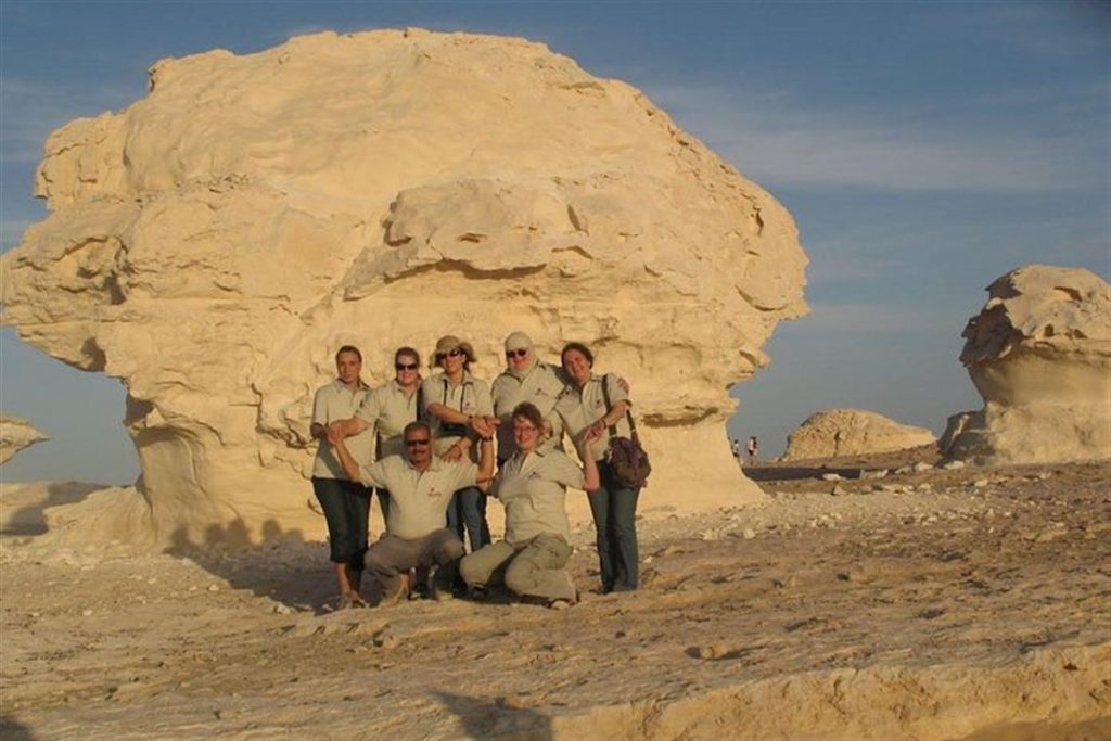Guests at the Mushroom and Chicken rocks in the White Desert