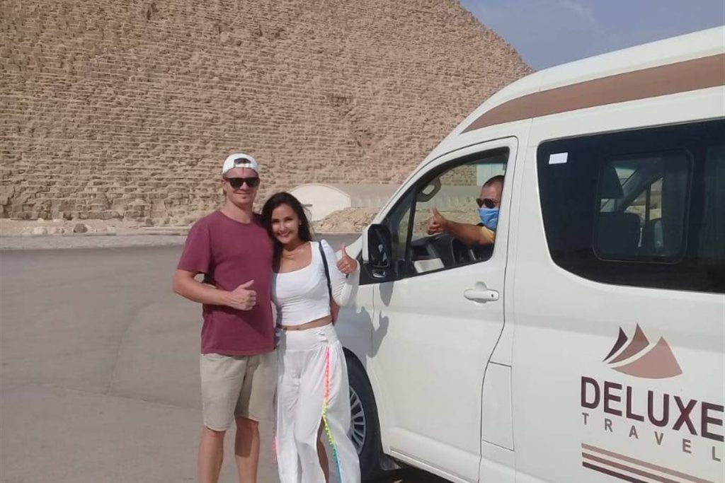 Guests with the Deluxe Travel Egypt van at the Pyramids