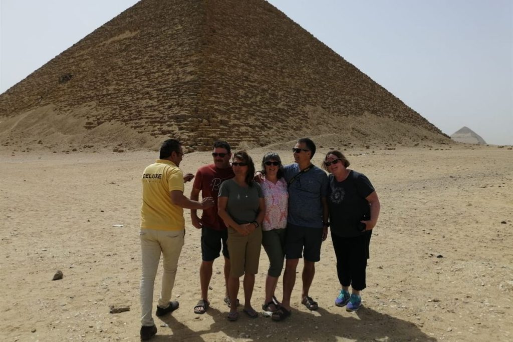 Egyptologist guide with guests at the Great Pyramid