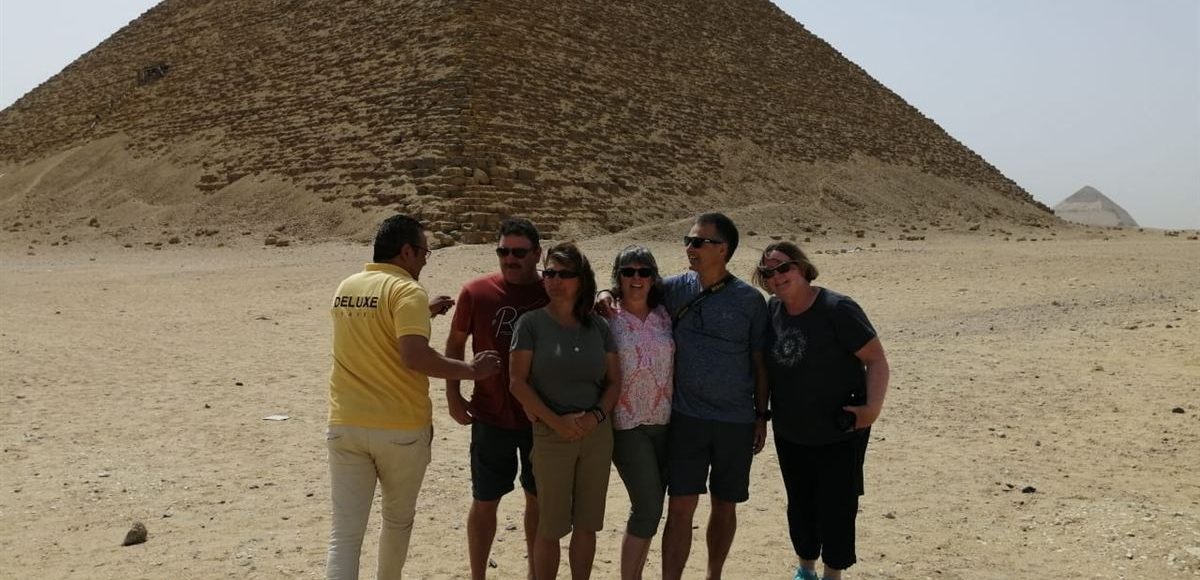 Egyptologist guide with guests at the Great Pyramid
