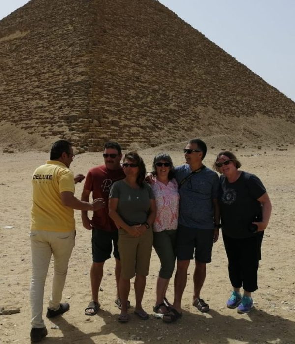 Egyptologist guide with guests at the Great Pyramid