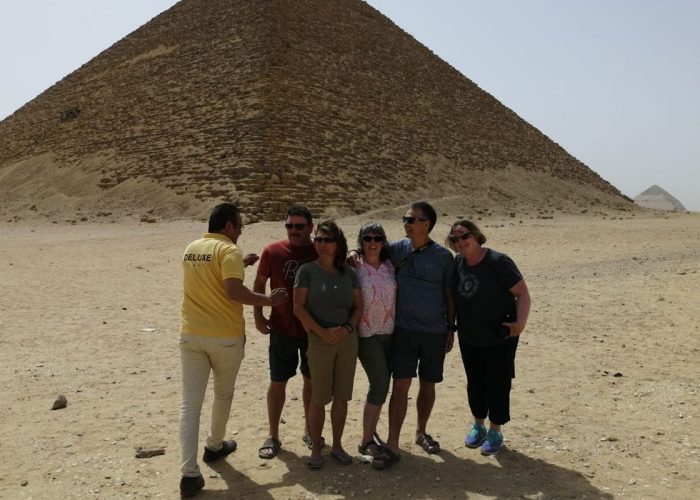 Egyptologist guide with guests at the Great Pyramid