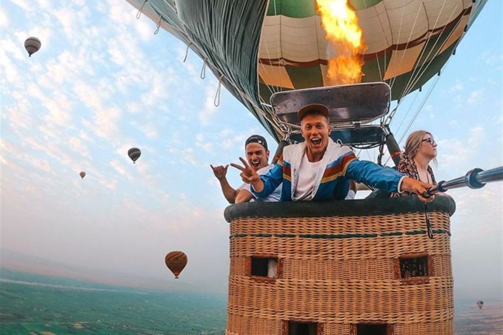 Guests flying in a hot air balloon over Luxor