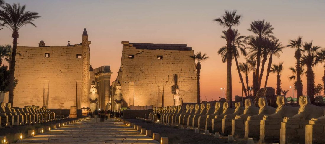 Luxor Temple and the Avenue of Sphinxes lit up at dusk