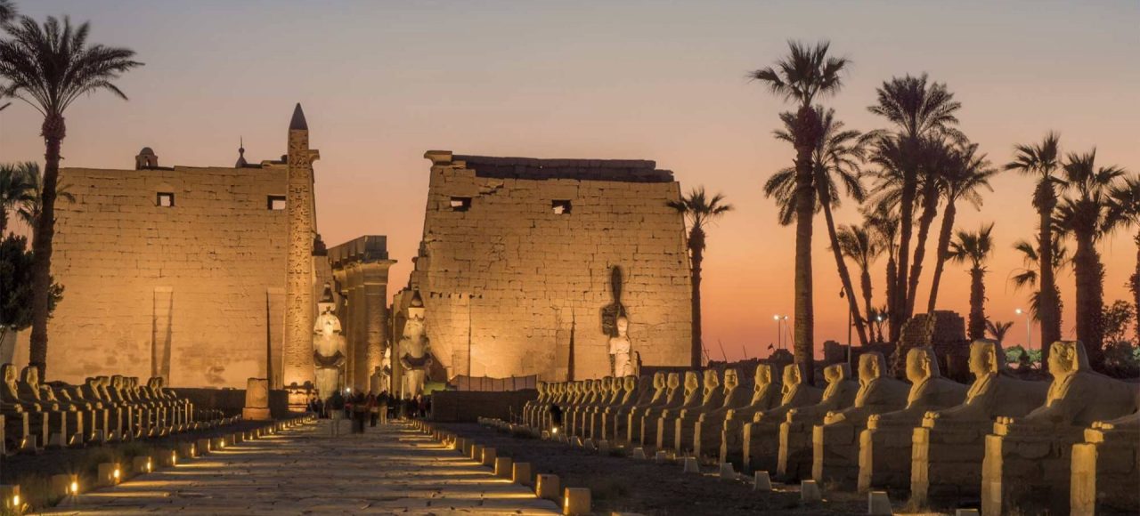 Luxor Temple and the Avenue of Sphinxes lit up at dusk
