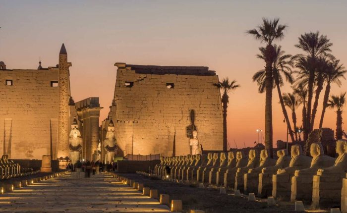 Luxor Temple and the Avenue of Sphinxes lit up at dusk