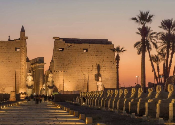 Luxor Temple and the Avenue of Sphinxes lit up at dusk