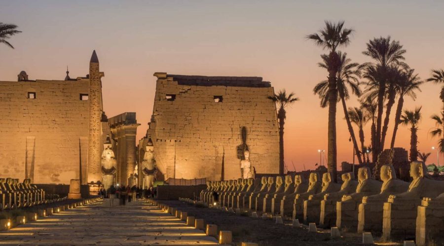 Luxor Temple and the Avenue of Sphinxes lit up at dusk