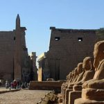 Entrance pylon and obelisk of Luxor Temple with the avenue of sphinxes