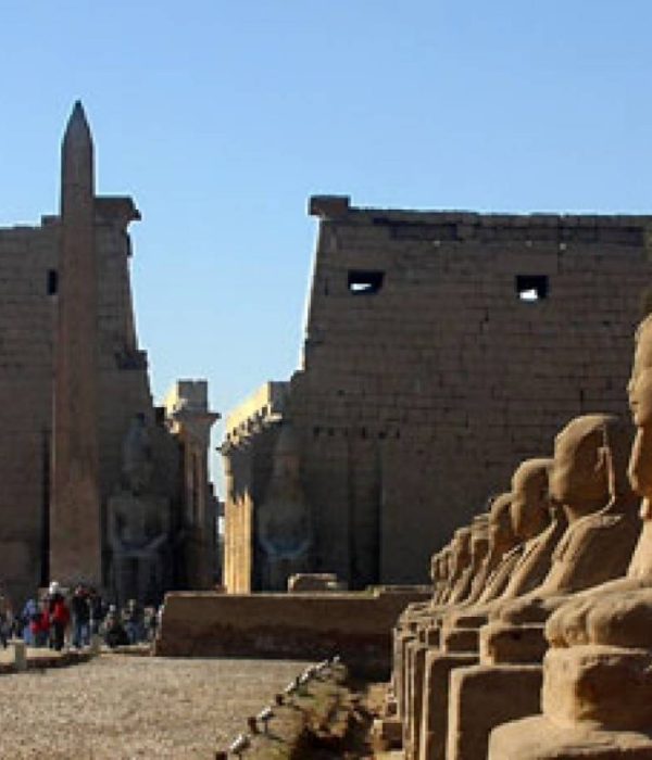 Entrance pylon and obelisk of Luxor Temple with the avenue of sphinxes