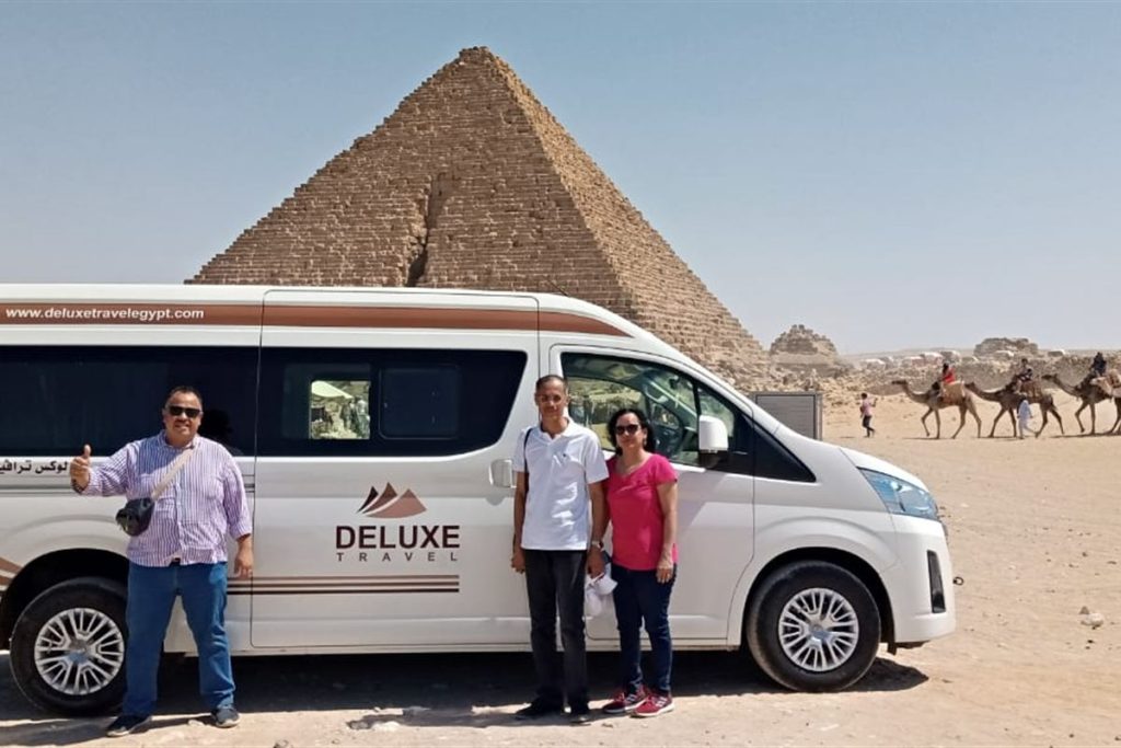 Deluxe Travel Egypt private van with guests at the Giza Pyramids
