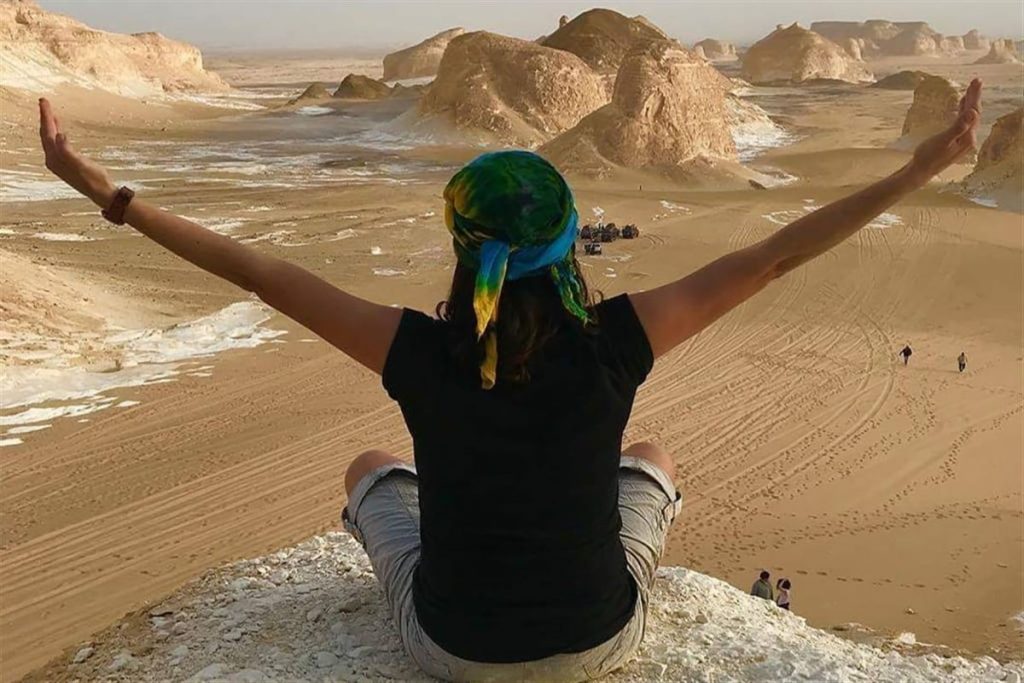 Traveller looking out over the White Desert, Egypt